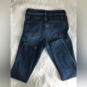 Medium wash blue high rise skinny jeans. Jeggings